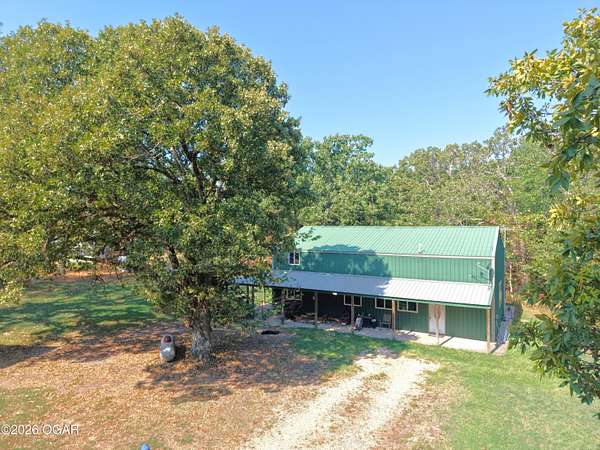 20.6 Acres of Recreational Land with Home for Sale in Goodman, Missouri