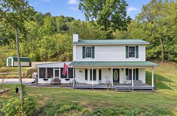 7.9 Acres of Land with Home for Sale in Dowelltown, Tennessee