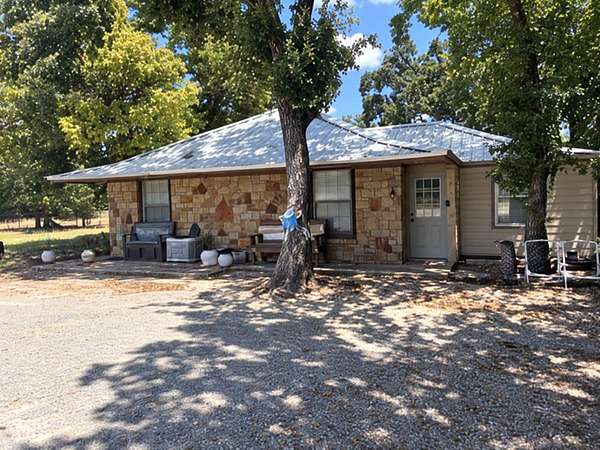 3.25 Acres of Land with Home for Auction in Poolville, Texas