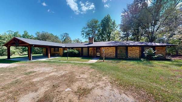 6.9 Acres of Land with Home for Sale in Jasper, Texas
