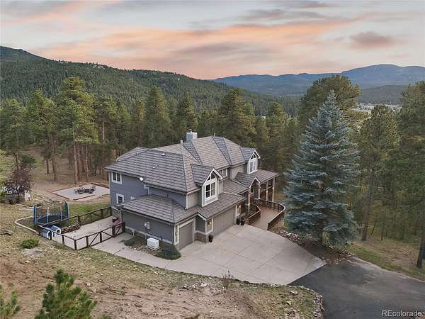 4.89 Acres of Land with Home for Sale in Evergreen, Colorado