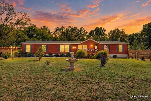 18.1 Acres of Land with Home for Sale in Gravette, Arkansas