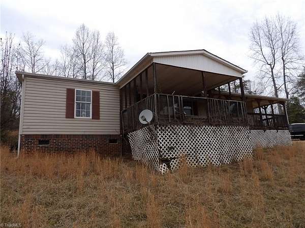 4.9 Acres of Land with Home for Sale in Boomer, North Carolina