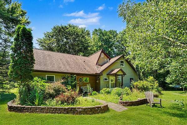 10.1 Acres of Recreational Land with Home for Auction in Grand Junction, Michigan