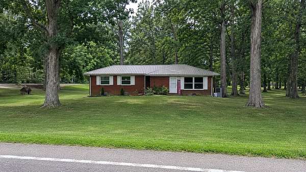 4.9 Acres of Land with Home for Sale in Cottontown, Tennessee
