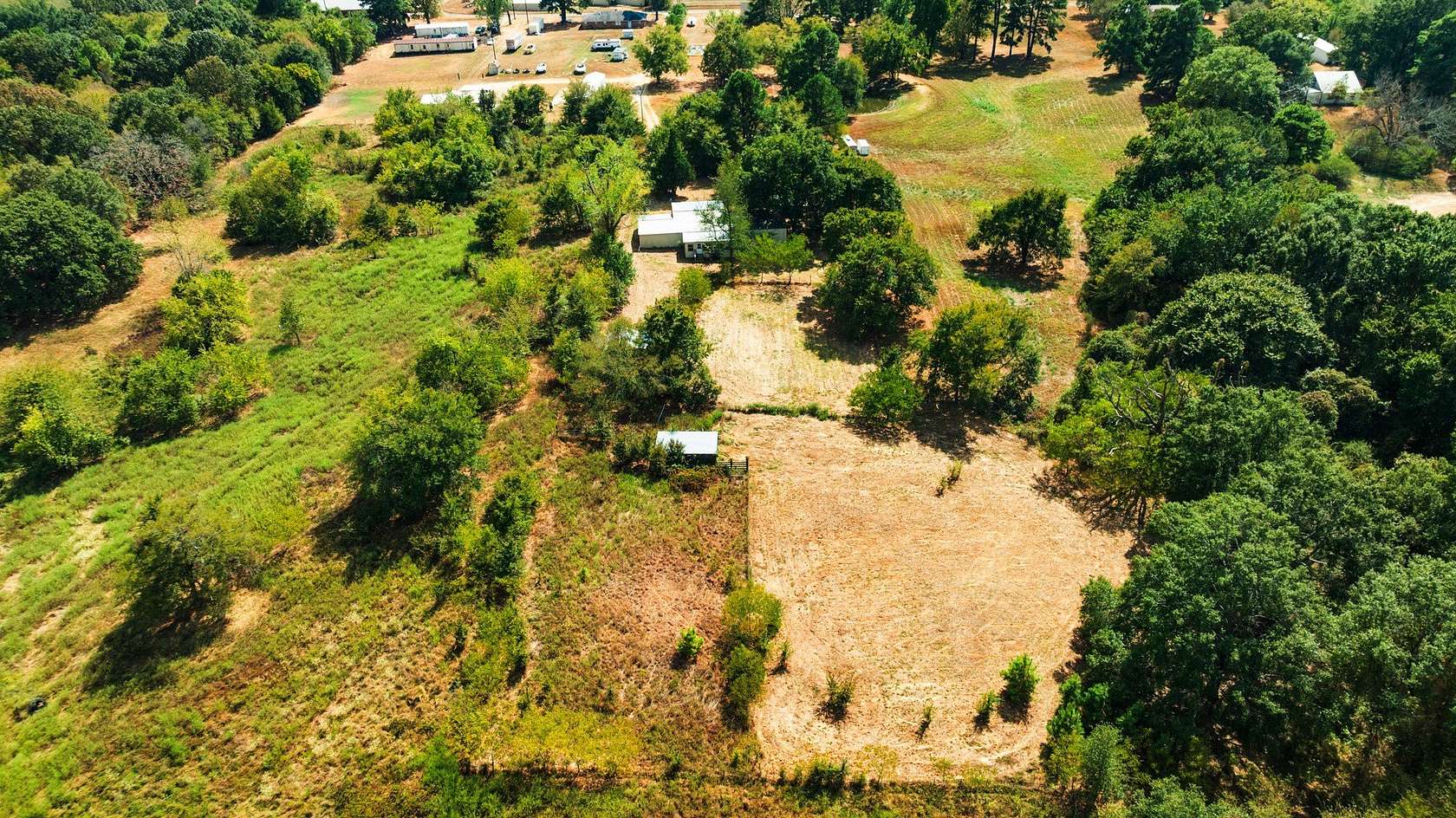 2.62 Acres of Land with Home for Sale in Arthur City, Texas
