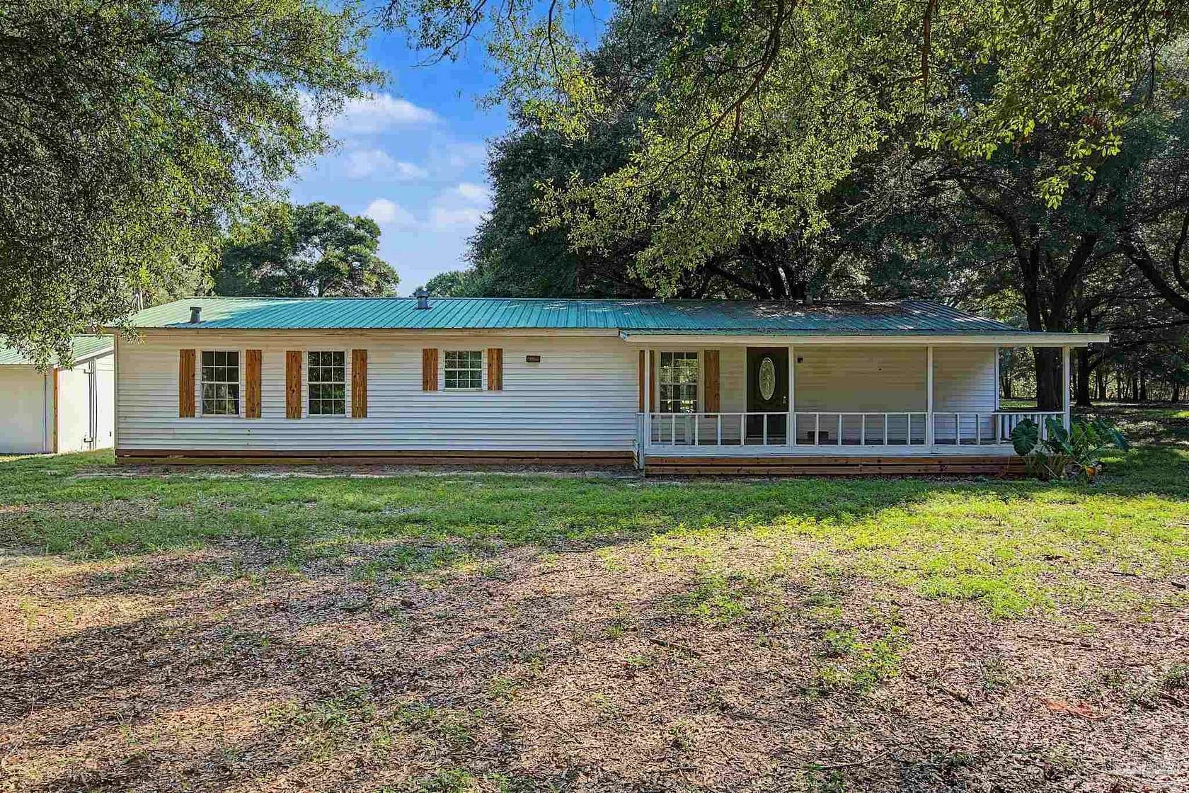 5.76 Acres of Land with Home for Sale in Holt, Florida