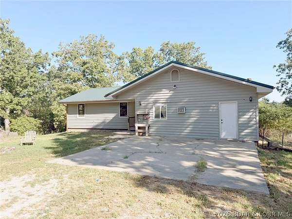 6.19 Acres of Land with Home for Sale in Macks Creek, Missouri