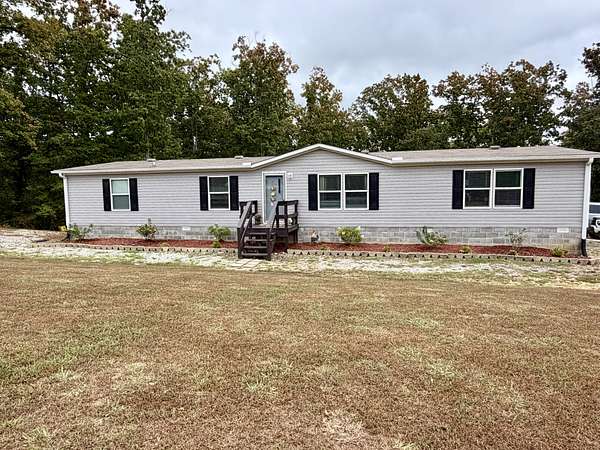 11.3 Acres of Land with Home for Sale in Hohenwald, Tennessee