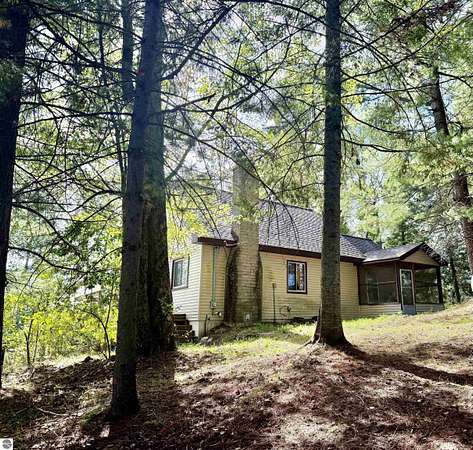 10 Acres of Recreational Land with Home for Sale in Falmouth, Michigan