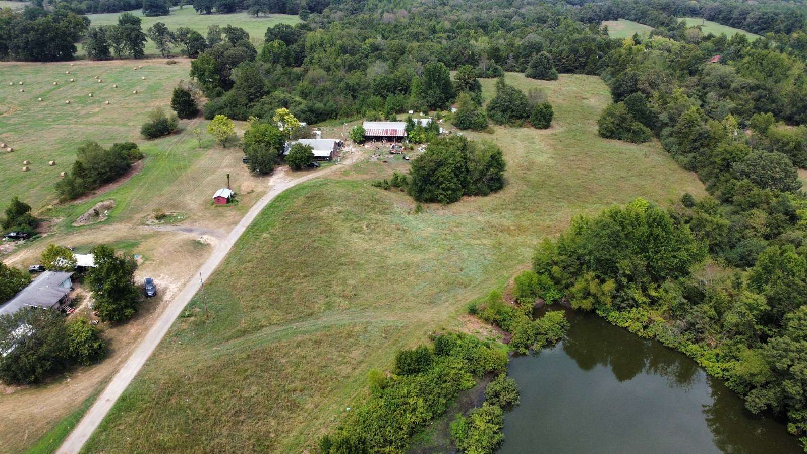 59 Acres of Recreational Land with Home for Auction in Hartman, Arkansas
