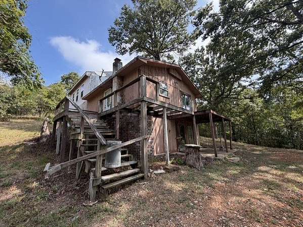 4.76 Acres of Land with Home for Sale in Garfield, Arkansas