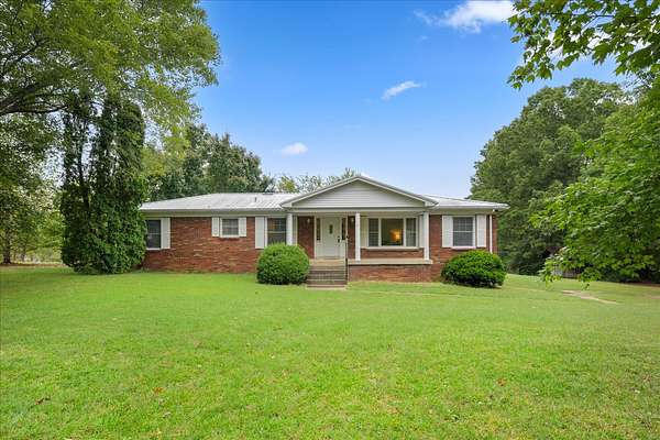 11.2 Acres of Land with Home for Sale in Charlotte, Tennessee