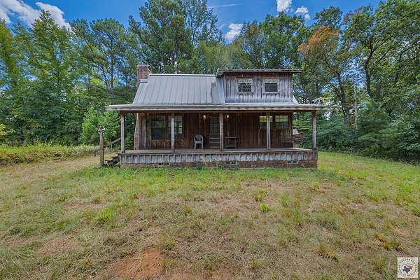 25.3 Acres of Recreational Land with Home for Sale in Linden, Texas