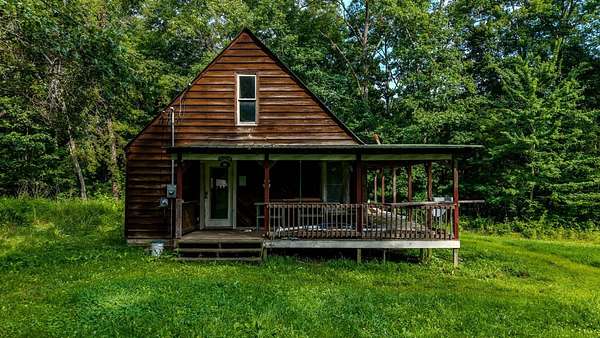 5.1 Acres of Land with Home for Sale in Deer Lodge, Tennessee