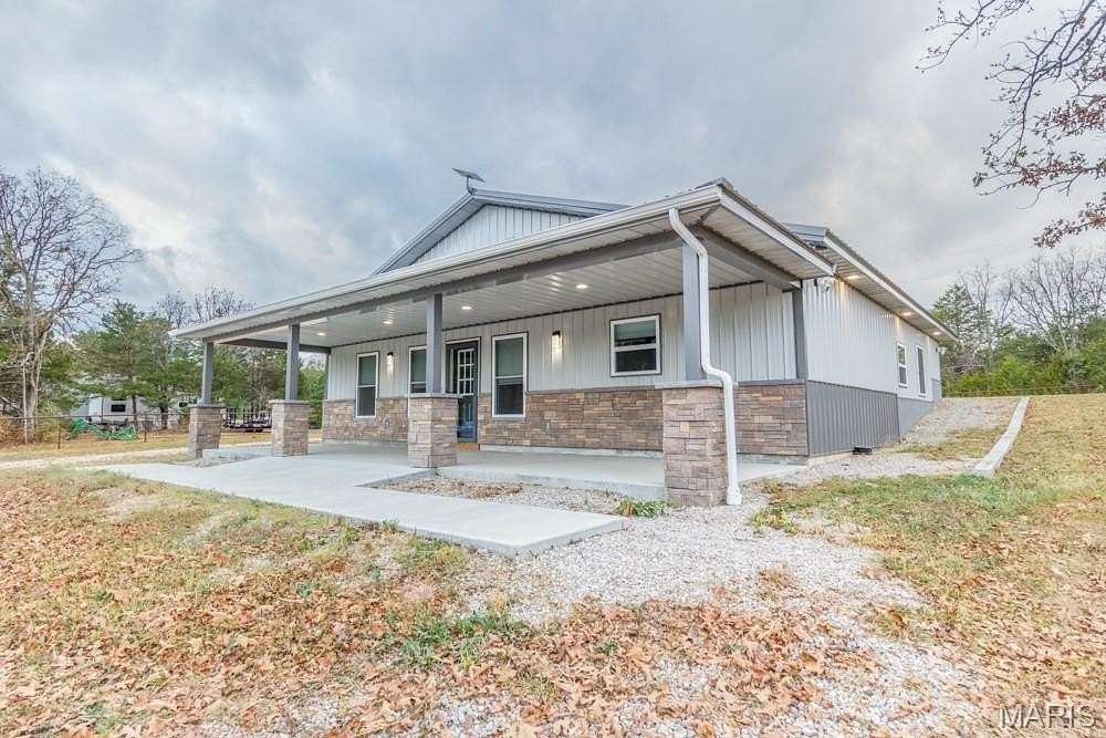 12.4 Acres of Land with Home for Sale in Laquey, Missouri
