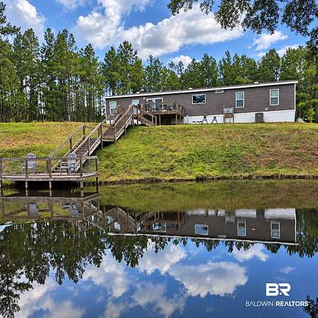 9.5 Acres of Land with Home for Sale in Castleberry, Alabama