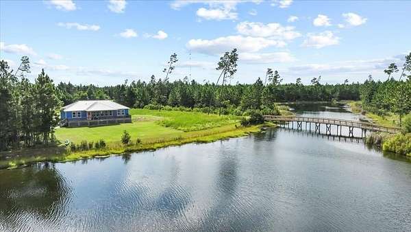 1.64 Acres of Land with Home for Sale in Wewahitchka, Florida