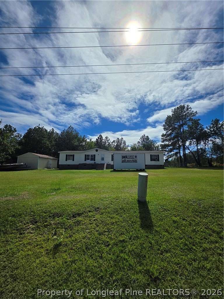 4.77 Acres of Land with Home for Sale in Bunnlevel, North Carolina