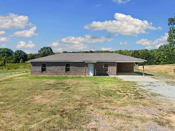 1.68 Acres of Land with Home for Sale in Romance, Arkansas