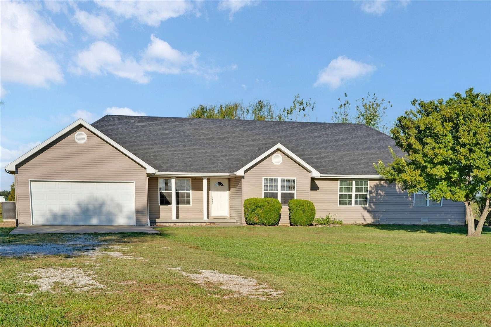 6.35 Acres of Land with Home for Sale in Collins, Missouri