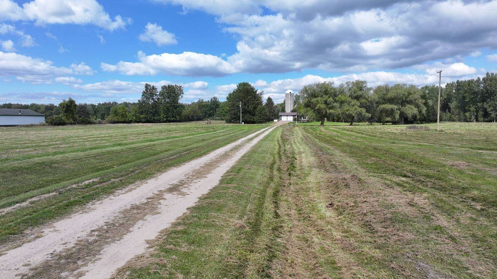 40 Acres of Land with Home for Auction in Shepherd, Michigan