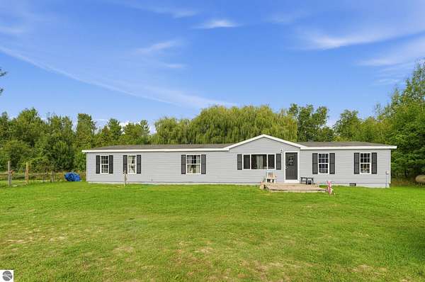 5 Acres of Land with Home for Sale in Charlevoix, Michigan