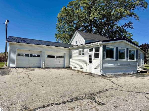 2 Acres of Land with Home for Auction in Ithaca, Michigan