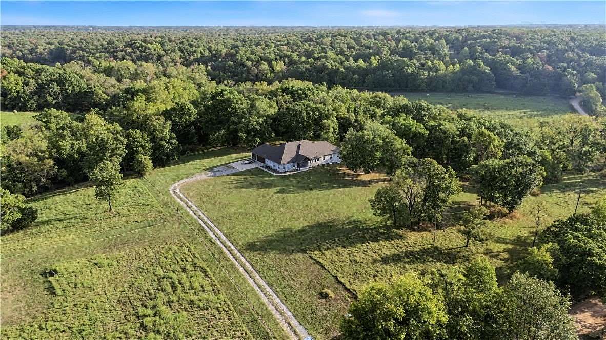 5 Acres of Land with Home for Sale in Gravette, Arkansas