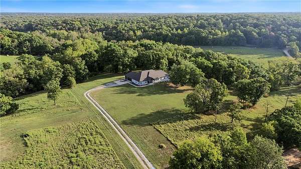 5 Acres of Land with Home for Sale in Gravette, Arkansas
