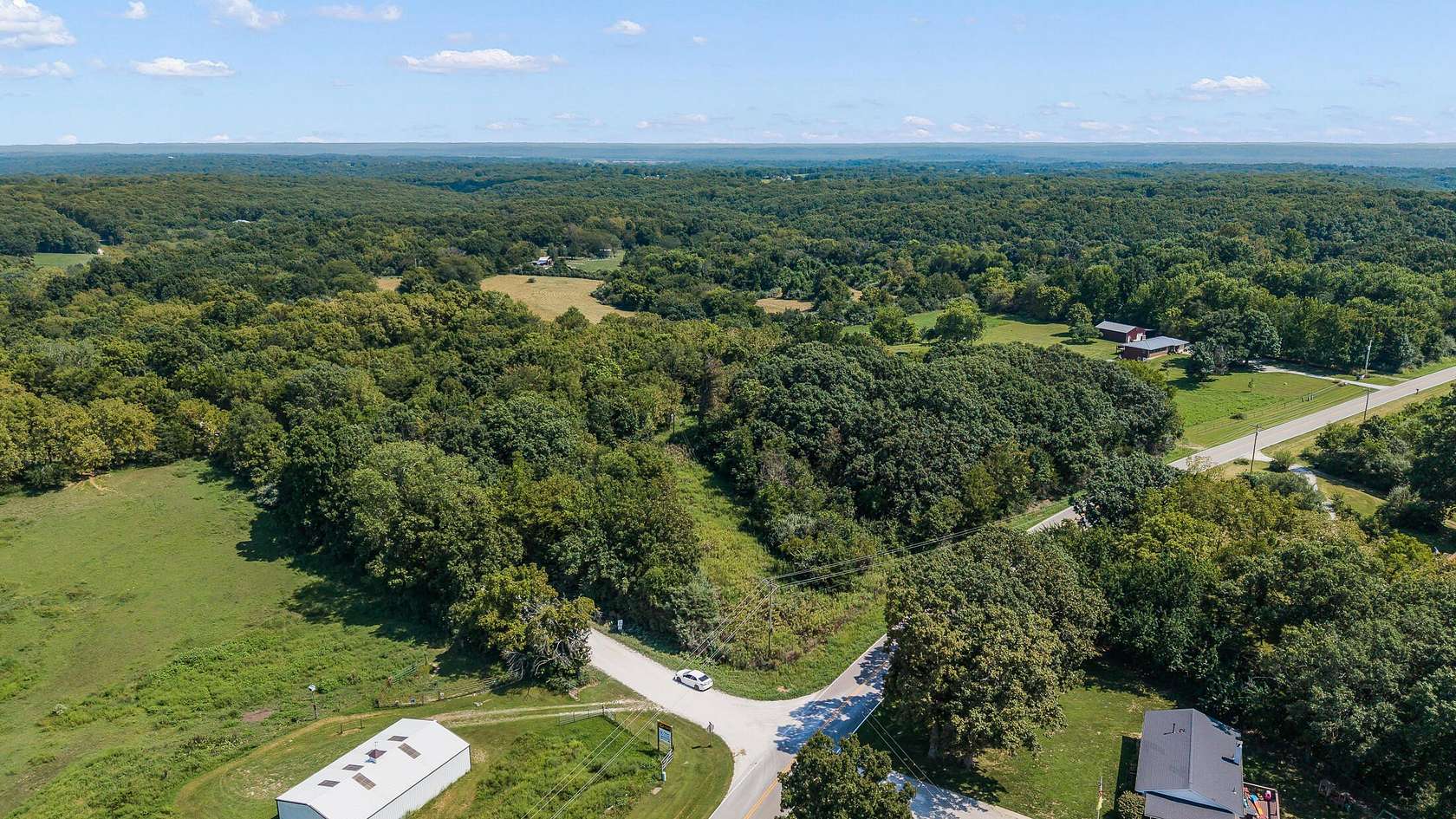 3.74 Acres of Land with Home for Auction in Holts Summit, Missouri