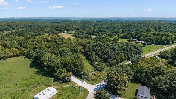 3.74 Acres of Land with Home for Auction in Holts Summit, Missouri