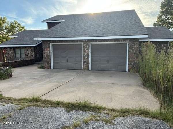 10.6 Acres of Land with Home for Sale in Sarcoxie, Missouri