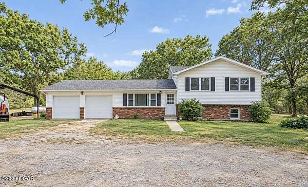 10 Acres of Land with Home for Sale in Goodman, Missouri