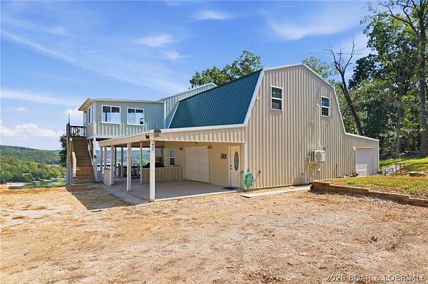 15.4 Acres of Land with Home for Sale in Camdenton, Missouri