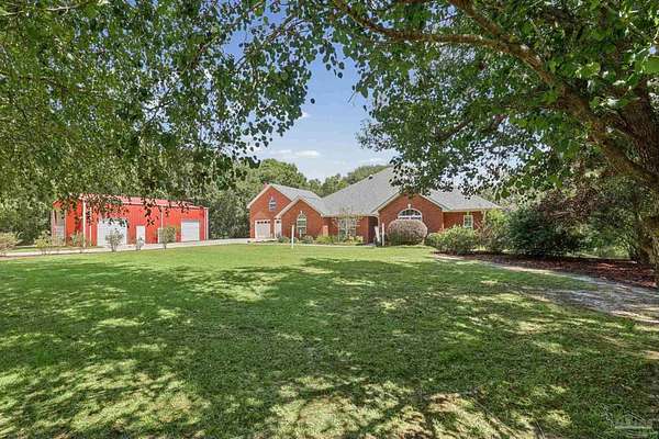 4.29 Acres of Land with Home for Sale in Pace, Florida