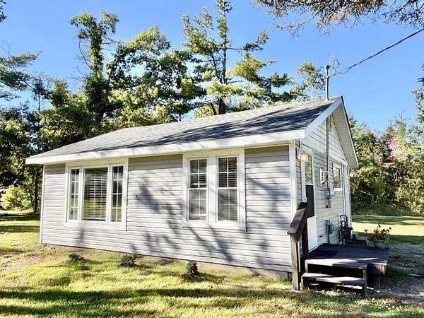 0.99 Acres of Land with Home for Sale in Lewiston, Michigan