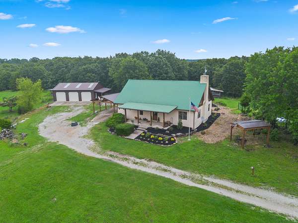 75 Acres of Land with Home for Sale in Taneyville, Missouri