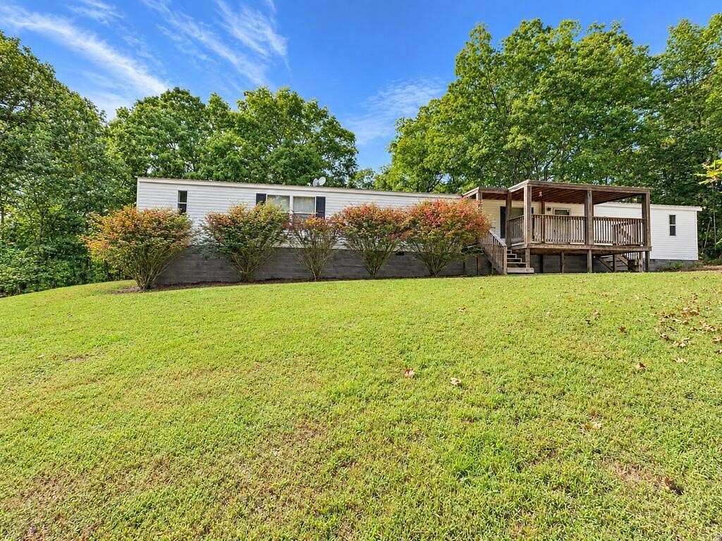4.88 Acres of Land with Home for Sale in Camden, Tennessee