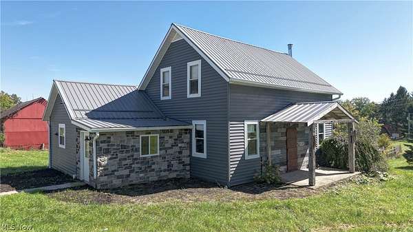 5.9 Acres of Land with Home for Auction in Millersburg, Ohio