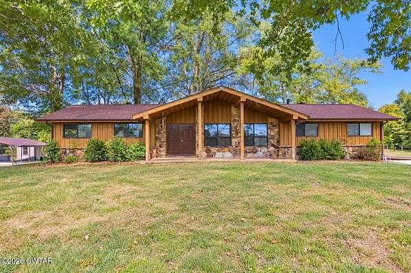 29.8 Acres of Land with Home for Sale in Scotts Hill, Tennessee