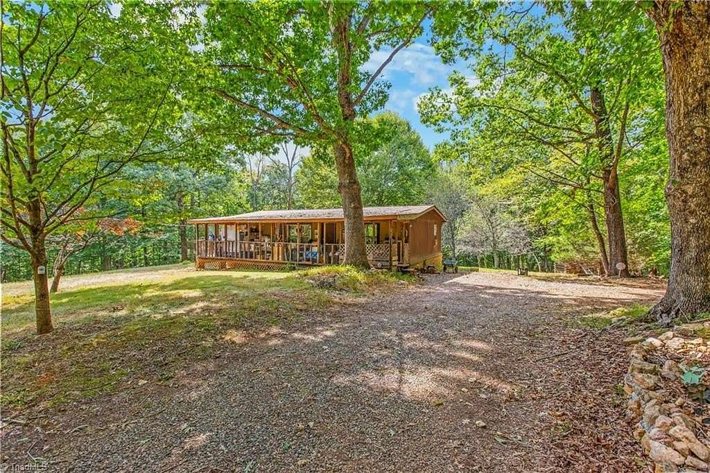 8 Acres of Land with Home for Sale in Sandy Ridge, North Carolina
