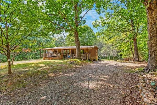 8 Acres of Land with Home for Sale in Sandy Ridge, North Carolina