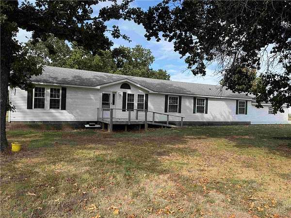 4.5 Acres of Land with Home for Auction in Neosho, Missouri