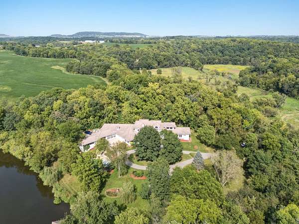 174 Acres of Recreational Land with Home for Sale in Durango, Iowa