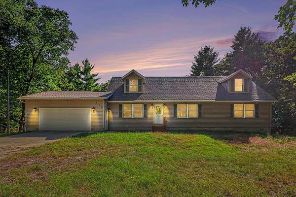 10 Acres of Land with Home for Sale in Twin Lake, Michigan