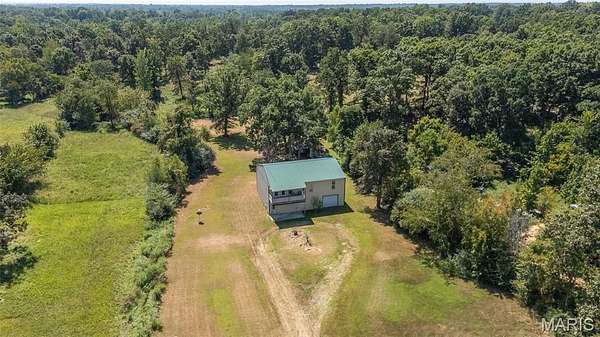 7 Acres of Land with Home for Sale in Poplar Bluff, Missouri
