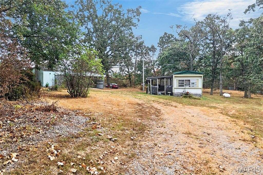 12.5 Acres of Land with Home for Sale in Phillipsburg, Missouri