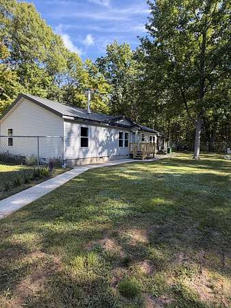 10 Acres of Recreational Land with Home for Sale in Irons, Michigan