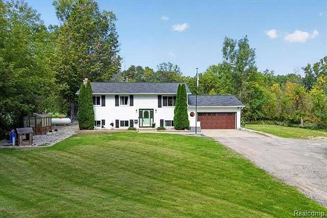 2 Acres of Land with Home for Sale in Oceola Township, Michigan